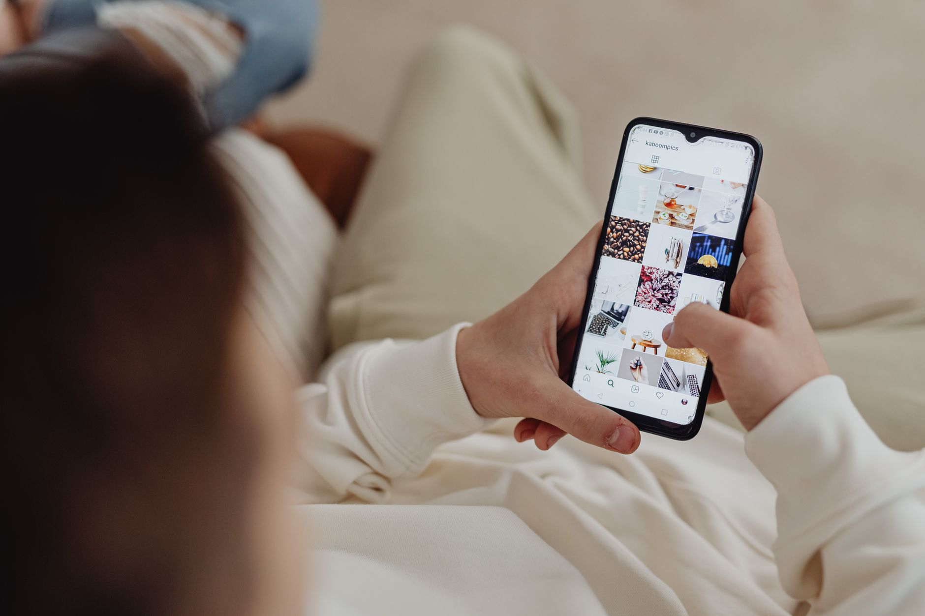 A person browsing a phone app casually
